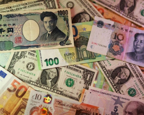 Dollar steady as traders await key US inflation data