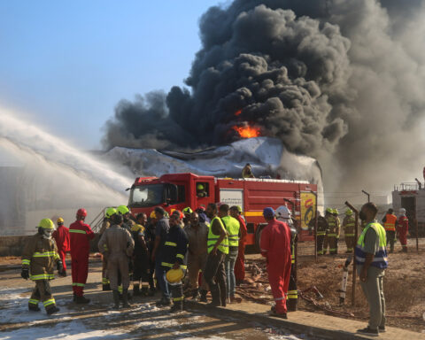 Drone strikes hit Libya's key western oil town and a car bomb kills an officer in the east