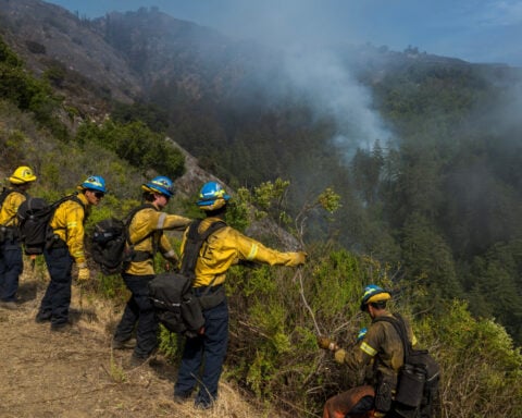 Wildfire in western Canada that has forced 20,000 to flee grew overnight