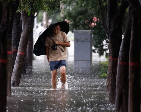 Rain pounds Beijing as Typhoon Dolphin sweeps through China