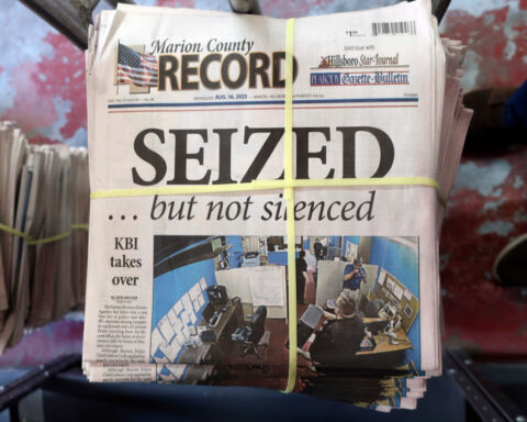A Kansas town will pay $850K to end a reporter's lawsuit over a 2023 raid on her paper's offices
