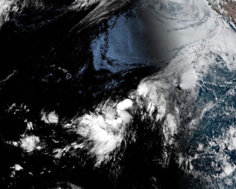 Forecasters warn a Pacific system could soak Hawaii as Tropical Storm Cristobal fades