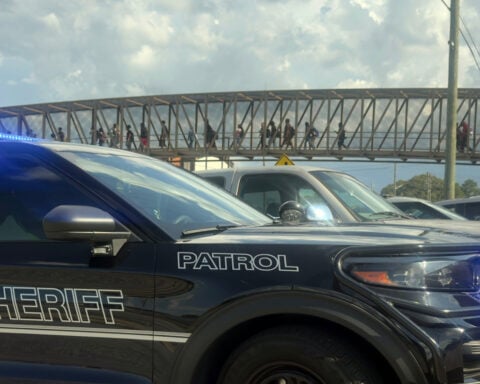 Student wounded and young suspect is in custody after shooting at Georgia high school, police say