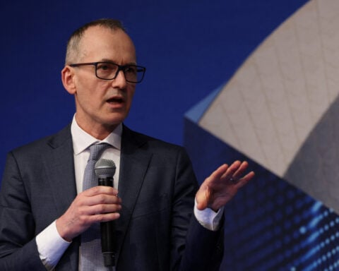 Australia central banker says rate risks are skewed higher