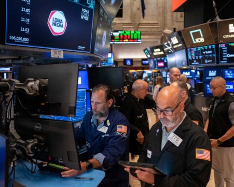 US stocks tick toward records as oil prices drop and inflation gets less bad