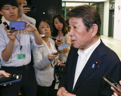 Putin's first trip to the Pacific island chain claimed by Japan draws a protest from Tokyo