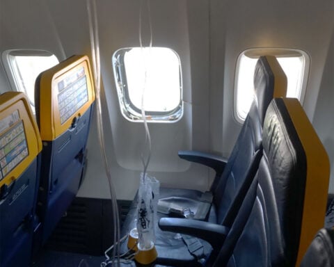 A jet engine fan blade cut into a plane and caused a passenger to be partially sucked out of a window, the NTSB says