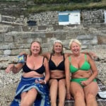 Three sisters posed for a photo on a beach in the 1980s. Over 40 years later they recreated it