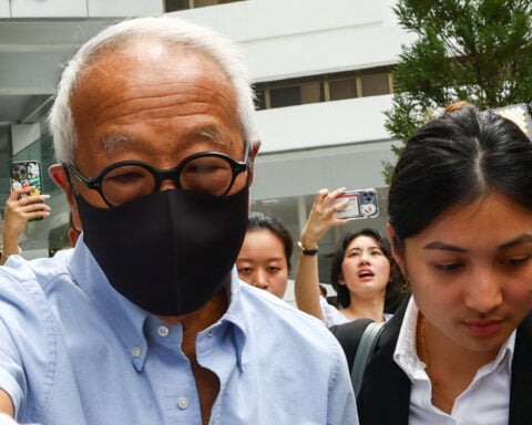 Singapore property tycoon linked to jailed minister pleads guilty