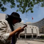 China leaves benchmark lending rates unchanged, as expected