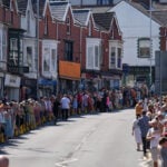 Bonnie Tyler fans line the streets of a Welsh village as her coffin is brought home