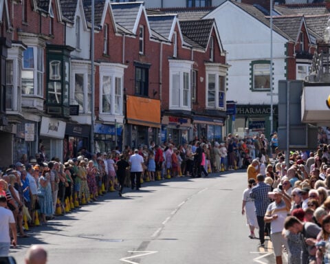 Bonnie Tyler fans line the streets of a Welsh village as her coffin is brought home