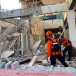 Rescuers dig through rubble and landslides after Indonesia quake kills 47