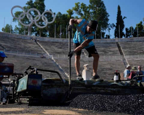 Athens is cleaning its all-marble Olympic stadium for the first time in more than a century