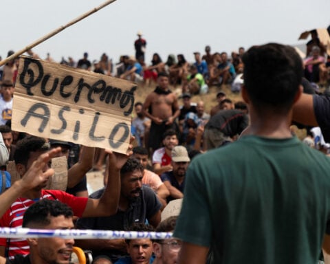 In Spain's Ceuta, hundreds of migrants stage protest and demand asylum