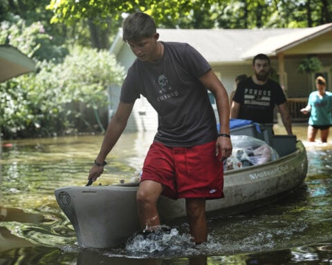 At least 7 people have died from days of heavy rain and record-setting flooding in Indiana