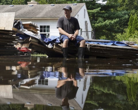 At least 7 people have died from days of heavy rain and record-setting flooding in Indiana