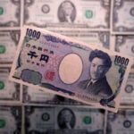 Yen edges up as traders push back Fed rate hike bets