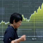 Asian shares are mostly higher while US futures and oil prices hold steady