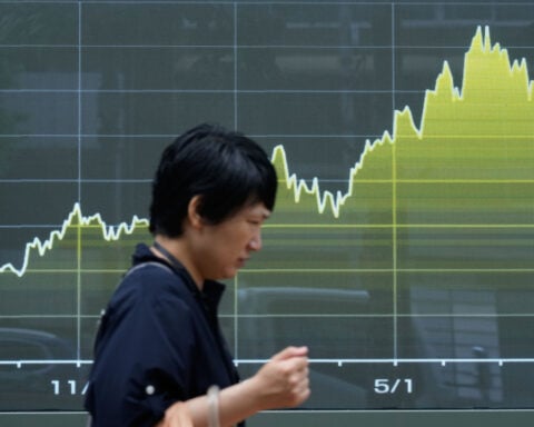 US stocks edge further from their record after oil prices rise