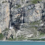A looming rock collapse threatens a Swiss village as thawing permafrost destabilizes the Alps