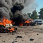 Ukraine aims a drone blitz at Moscow while Russian missiles kill 10 in a Ukrainian village