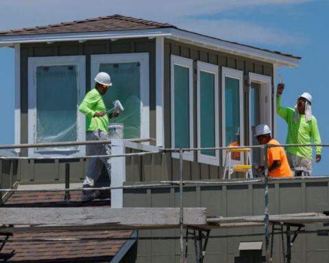 US housing market remains under pressure in July; factory output rises