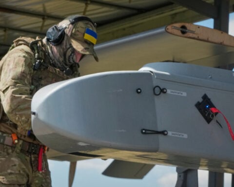 A warehouse burns near Moscow. In Ukraine, drone crews prepare to strike again