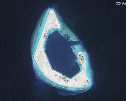China completes first stage of work at disputed South China Sea reef, images show