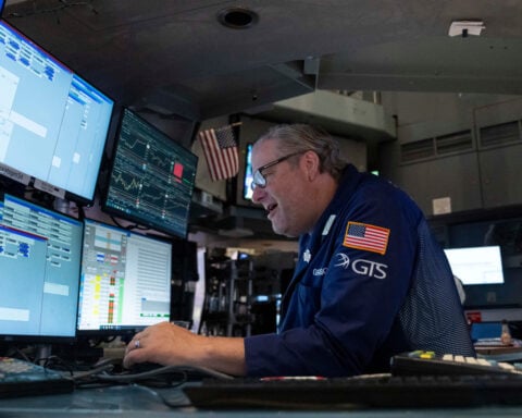 US stocks halt their slide after the Treasury Department moves to ease pressure from the bond market
