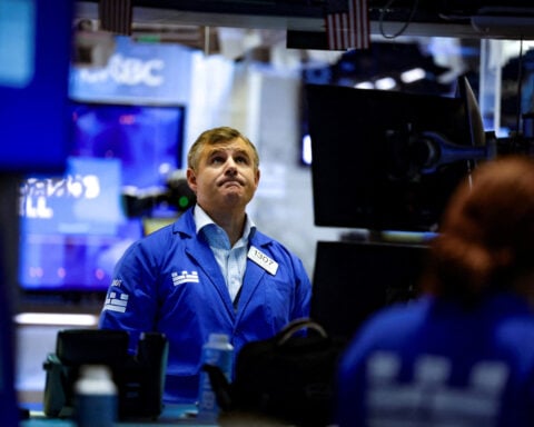 Wall St opens up after tech-led slump as yields ease; earnings watched
