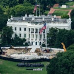 Trump the builder carves his legacy in stone as pressures mount