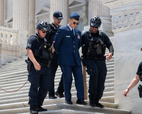 US airman arrested at Capitol after calling for Trump’s impeachment is detained again