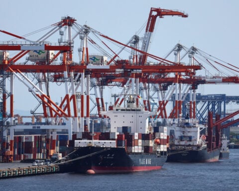 Japan's exports surge on chips demand, imports hit record on oil costs