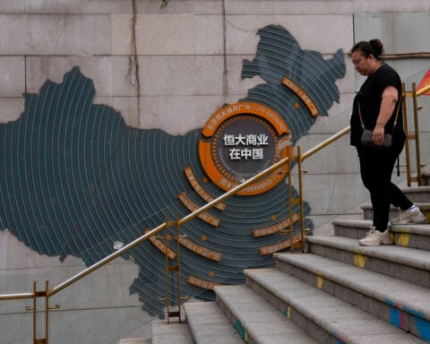 Chinese court sentences founder of troubled property developer Evergrande to life in prison