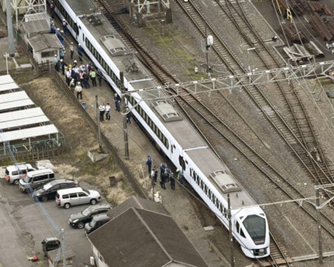 Express train hits and kills 4 workers at a railway station in Japan