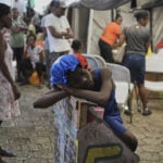 First group of deportees arrives in troubled Haiti after US ends TPS program