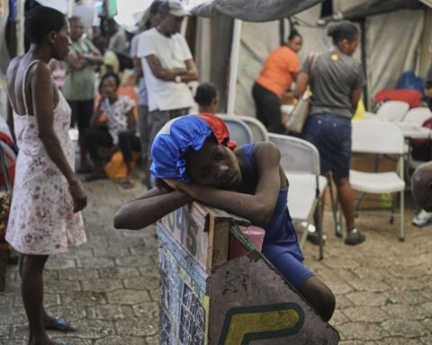 First group of deportees arrives in troubled Haiti after US ends TPS program