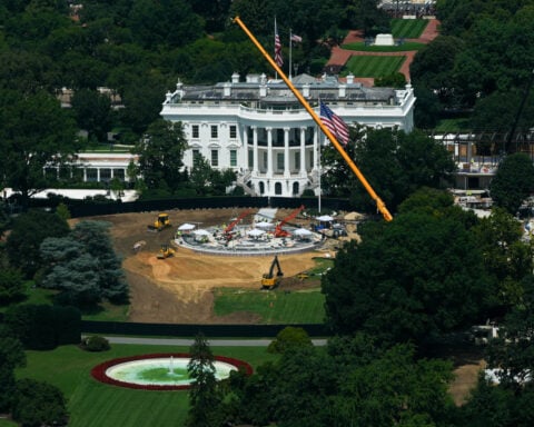 The Latest: Supreme Court chief justice allows White House ballroom renovation to continue for now