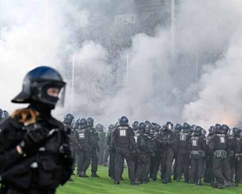 German Cup match marred by fireworks, pitch invasion