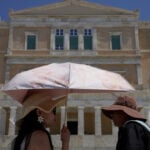 The sunhat is everywhere in Athens as crowds grow larger at ancient sites