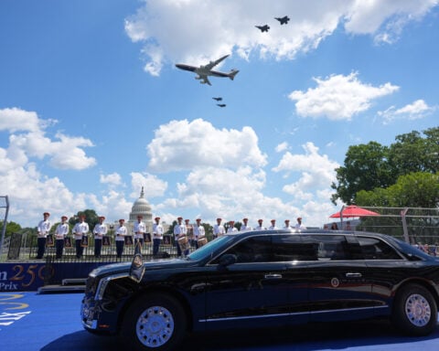 Trump waves the green flag to start the IndyCar race as drivers zoom through Washington's streets