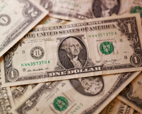 Dollar higher after Iran sanctions, loonie drops after US announces tariff increases