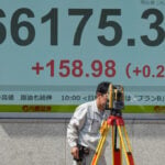 Asian shares mostly decline as bond market pressure mounts