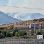 Firefighters are trying to stop a fast-moving Nevada wildfire from spreading to homes in Reno
