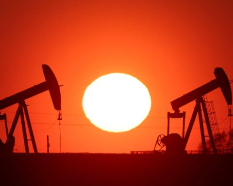 Oil settles down more than 3%; investors shrug off US sanctions on Iran