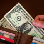 Dollar struggles for traction as markets weigh Iran sanctions, Treasury buybacks