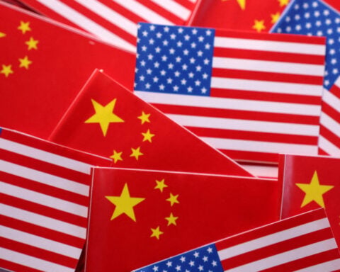 US lawmakers urge Trump to ban Americans from aiding Chinese security agencies
