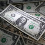 Dollar moves in a narrow range ahead of inflation data, Jackson Hole