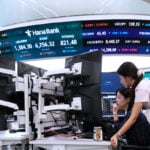 Asian shares mostly rise as oil prices fall and hope grows for AI